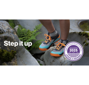 Robust outdoor shoe in gray with turquoise-orange accents, high shaft, and grippy treaded sole for secure footing.