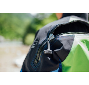 Dry suit for whitewater with waterproof material, latex cuffs, and reinforced areas for kayaking.